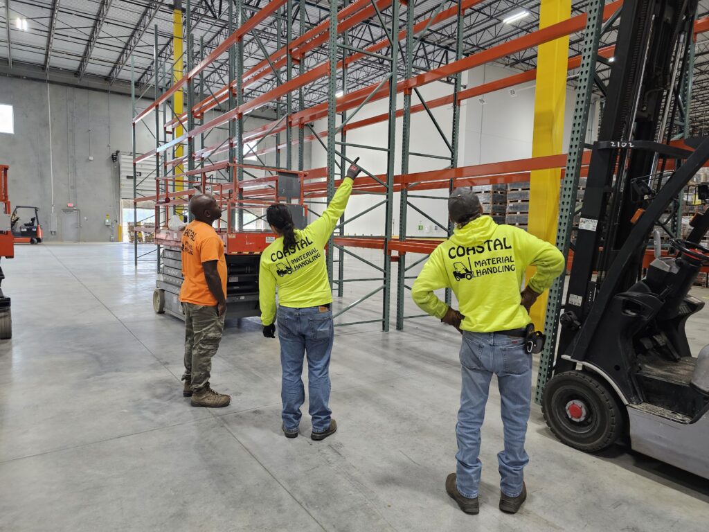 The Coastal Material Handling team building a warehouse racking set up for MSI of Suffolk, Virginia.