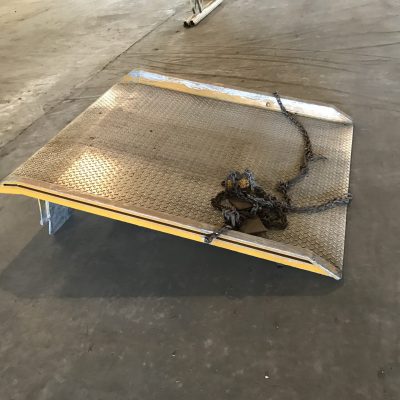 dock plates on the ground a stainless steel dock plate on the ground with steel chains