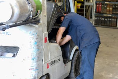 Man working on forklift - Forklift Service