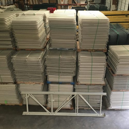 Stacks of wire decking secured on the warehouse floor.